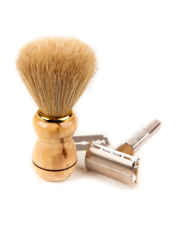 Classic old style shaving brush and razor isolated on white, copy for space