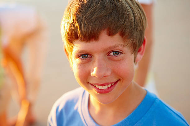 Young multiracial boy Indian-Iranian looking at camera smiling