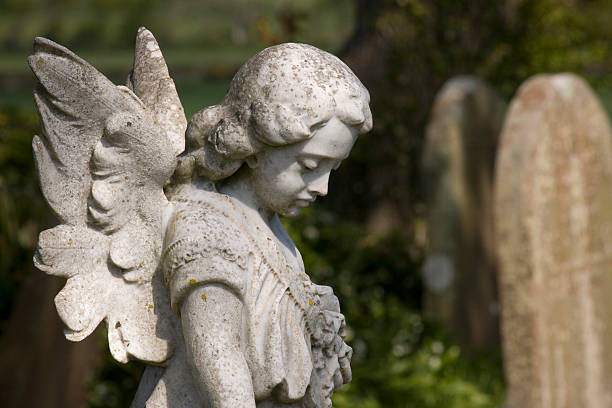 istock Angel statue in cemetery 182721038