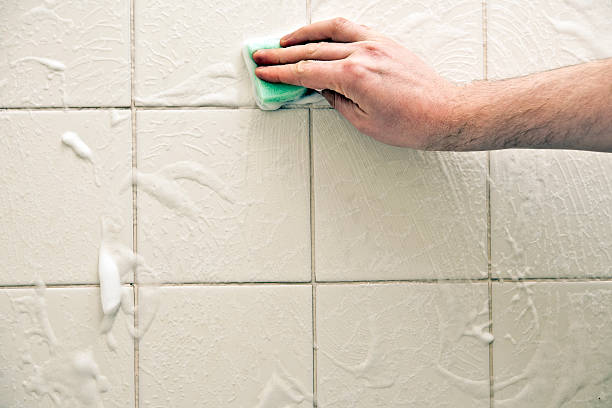 istock Scrubbing dirty bathroom tiles 182721088