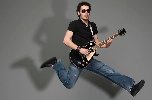 Flying Guitarist: Rock Out! stock photo