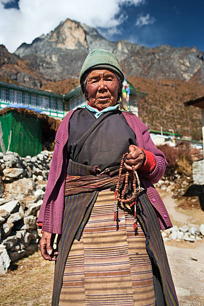 istock Nepali woman with rosary 182721225