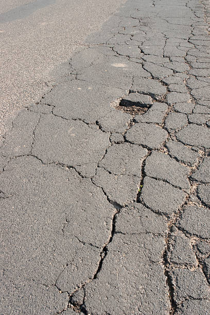 istock Damaged road close-up 182721430