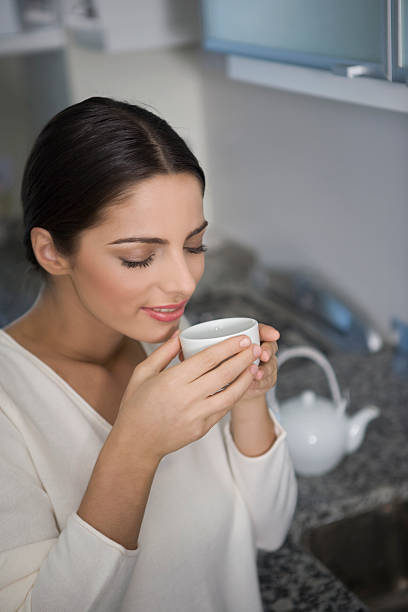 istock Young Woman Drinking Tea 182721695