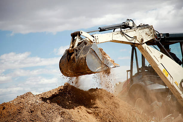 istock Backhoe Digging A Scoop of Dirt 182722087