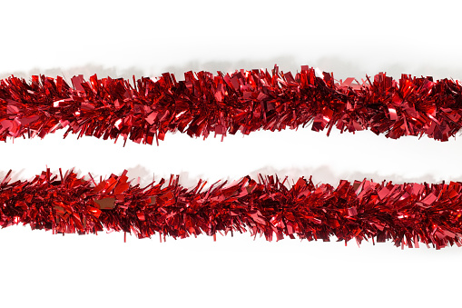 Two red Tinsel Decorations Garland for Xmas Tree, Christmas Tinsel Decorations for Wall Windows Wreath Stairs Bannister Fillable Baubles Ceiling Party Decorations, white background, isolated.