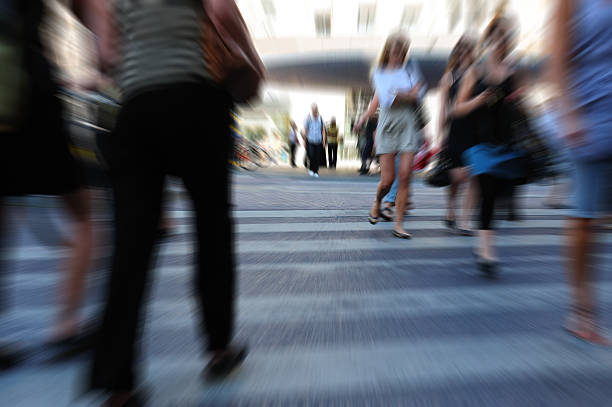 istock Young people crossing street, motion blur 182723572