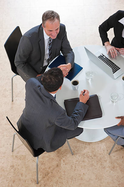 istock arial view of Business Group Working on a laptop 182723620
