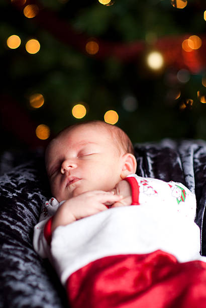 Infant Sleeping in Santa Hat stock photo