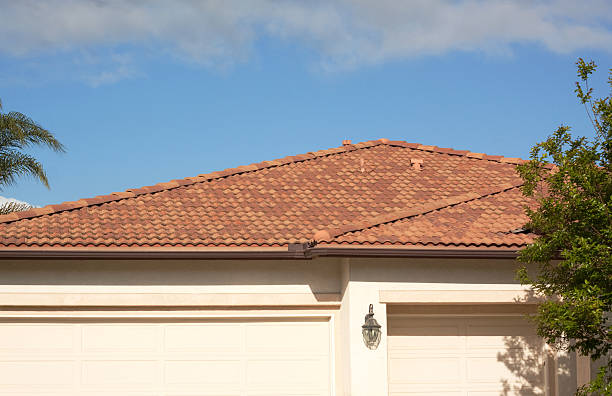 istock Stucco Home Exterior Tile Roof and Blue Sky 182724031