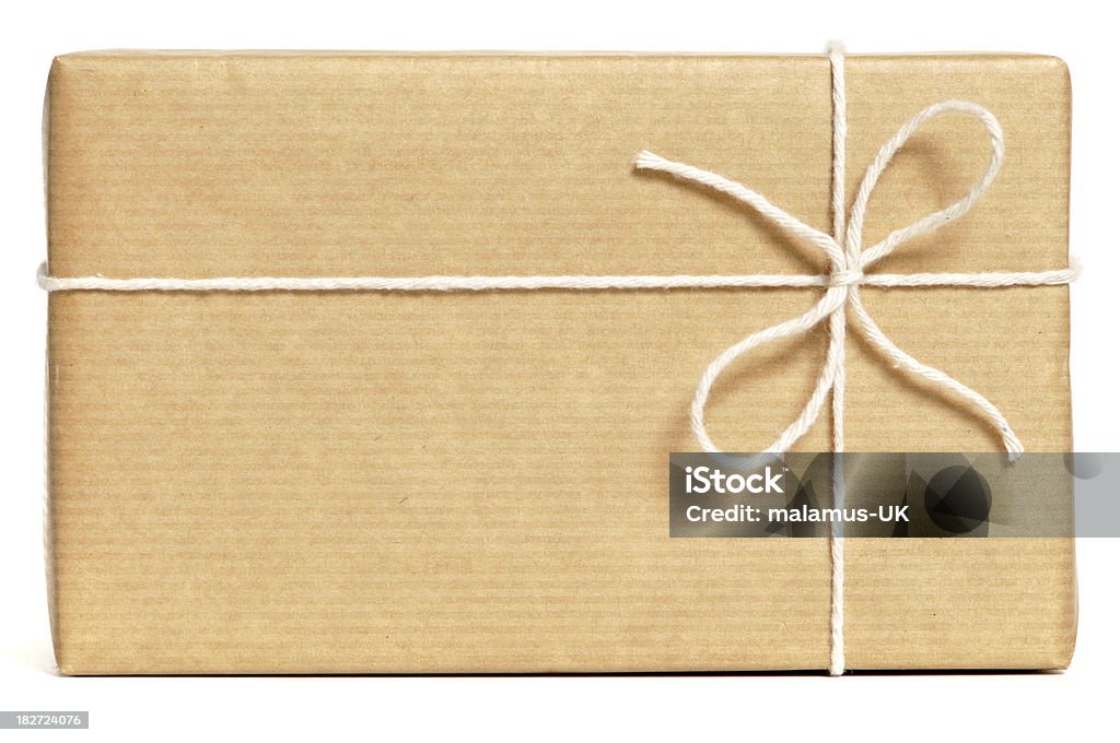 Brown wrapped parcel Brown wrapped parcel isolated on white. No sharpening. Gift Stock Photo