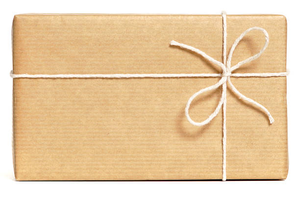 Brown wrapped parcel Brown wrapped parcel isolated on white. No sharpening. wrapped stock pictures, royalty-free photos & images