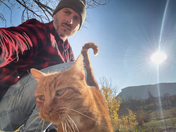 istock portrait of a man with a cat 1827243878