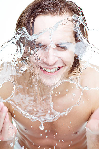 istock Young adult man refreshing with water 182725027