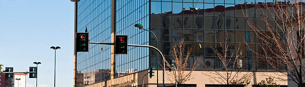 istock Modern Cityscape With Mirrored Skyscraper  And Traffic Lights 182725398