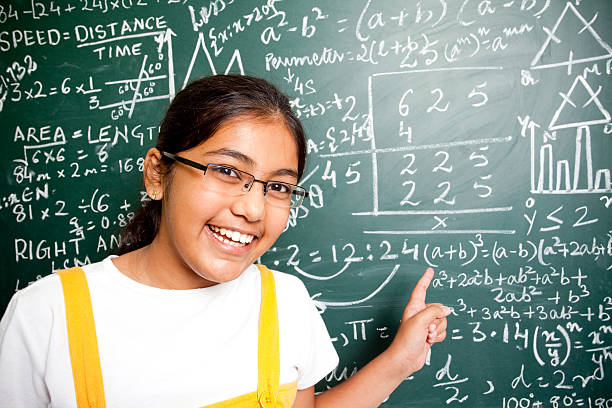 istock Cheerful Indian Girl Student with Mathematics Problems 182725404