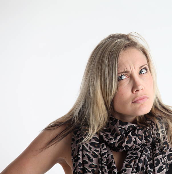 istock Puzzled Woman Looking Up 182726015