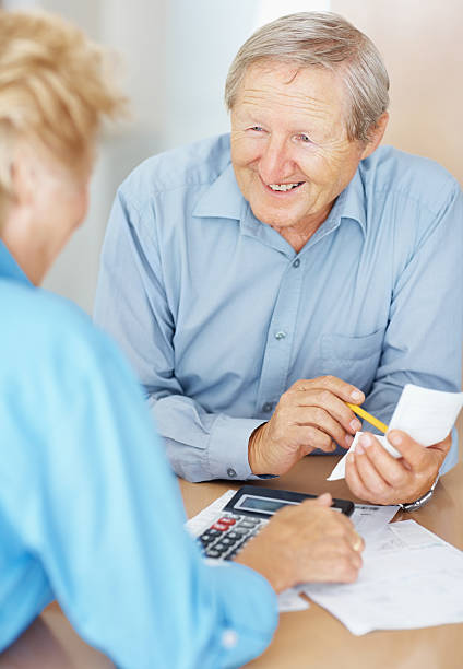 istock Happy senior couple working on home finances 182726421