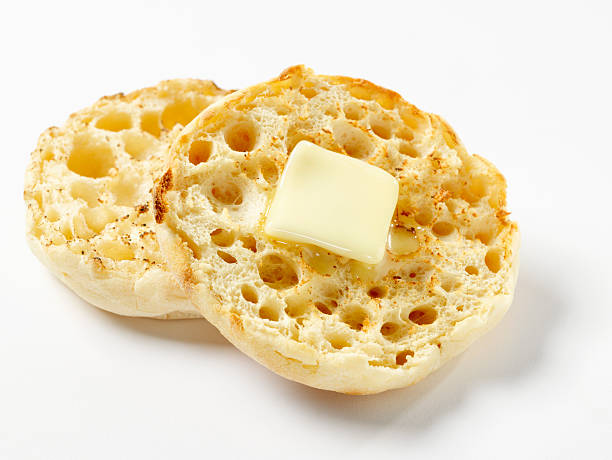 Toasted English Muffin with Butter Toasted English Muffin with Butter -Photographed on Hasselblad H1-22mb Camera english muffin stock pictures, royalty-free photos & images
