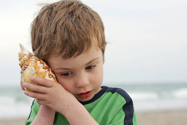 istock I Hear the Ocean. Child at Beach 182727217