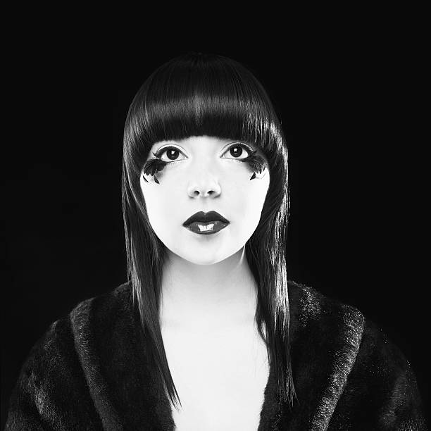 istock Woman With Feathers Under Her Eyes and Fur Coat. Isolated 182727690