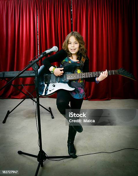 Child Singing And Playing On Stage Stock Photo - Download Image Now - Girls, Stage - Performance Space, 8-9 Years