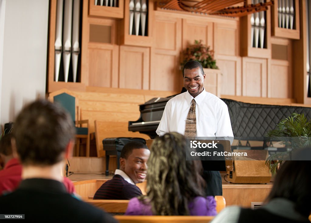 Church A group of people listening to a sermon in church - Buy credits Preacher Stock Photo