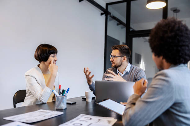 istock A businessman is giving ideas and solutions for project while having presentation in boardroom. 1827281737