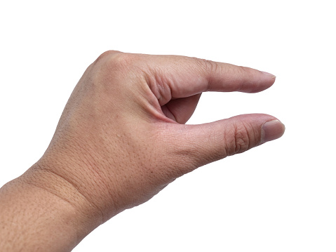 Human hand pinching something gesture, cut out isolated on white