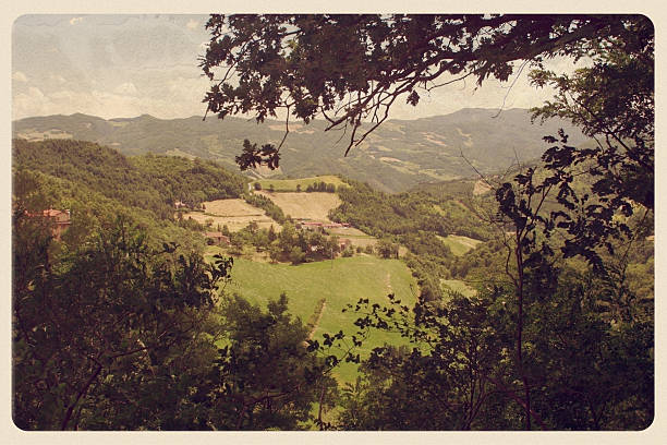Retro-styled postcard of a rolling Tuscan landscape in Italy.