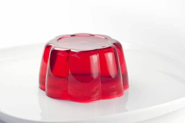 Red jelly with cherry flavor on a white plate