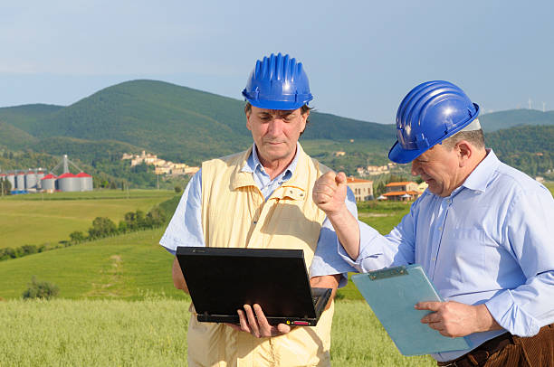 istock Two Engineers with PC Discussing in the Countryside 182732075