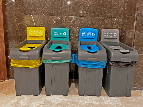 Recycling bins. Glass, metal, plastic, paper.