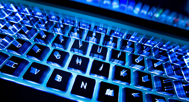 istock A laptop keyboard with blue lighting under each key 182732716