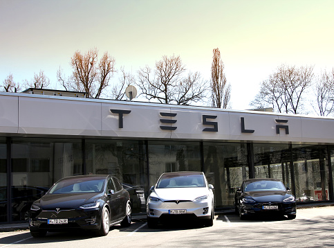 Nurnberg, Germany: Tesla Motors service center with multiple luxury Tesla cars inside. Tesla is an American company that designs, manufactures, and sells electric cars