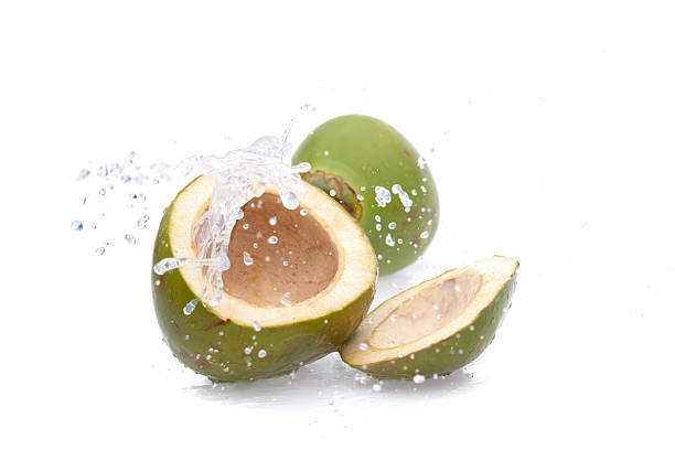 istock water splashing from green coconut 182733304