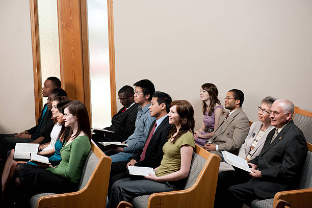 Church service A diverse church congregation worshipping together - Buy credits baptist stock pictures, royalty-free photos & images