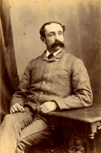 Vintage photograph of a gentleman from the Victorian era circa 1880 with a bushy moustache.