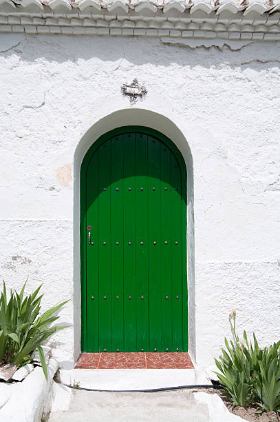istock Bright Green Door archway with white plaster wall 182734182