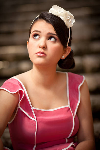 istock hispanic quinceanera looking up 182734661