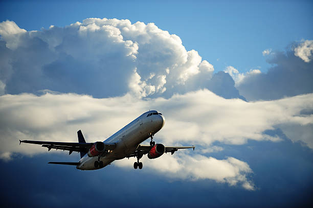 istock Sunlit airplane taking off in bad weather 182734736