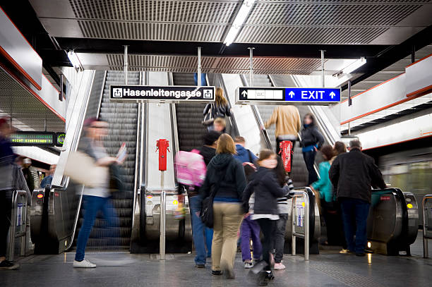 istock moving stairs with people 182734941