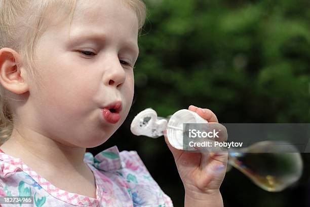 Blowing Bubbles Stock Photo - Download Image Now - Child, Focus On Foreground, Playful