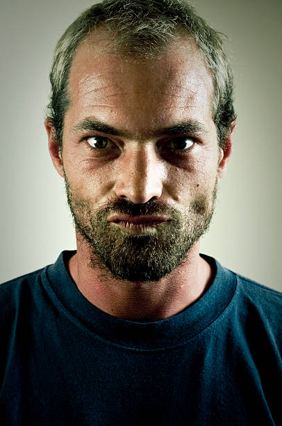 istock A portrait of a young man with a beard and serious face. 182736110