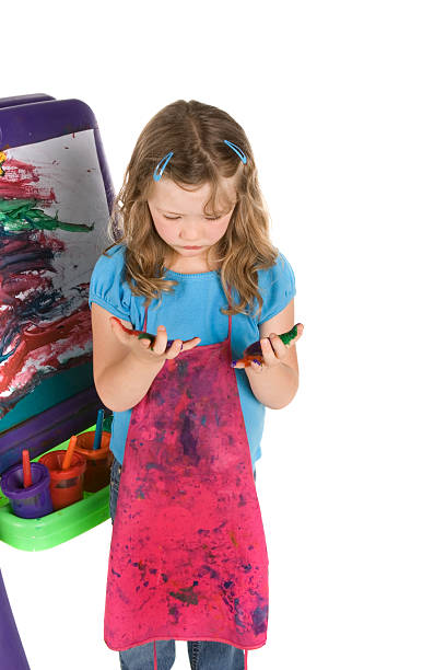 istock Little artist looking down at her hands 182736206