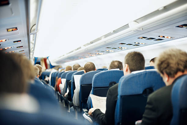 istock Airplane aisle with group of passengers 182736769