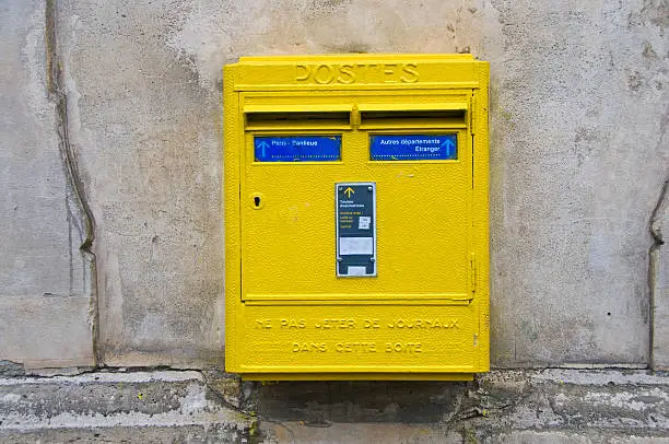 "Mailbox affixed to wall in Paris, France"