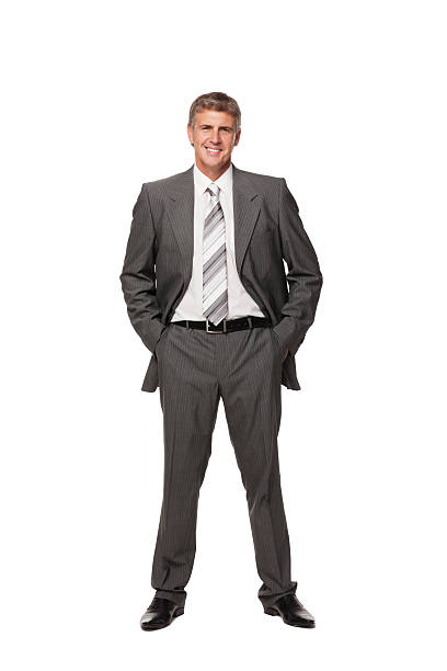 istock Smiling Businessman With Hands in Pockets. Isolated 182738906