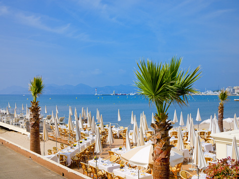 Neatly organized beach restaurant in Cannes, France. \