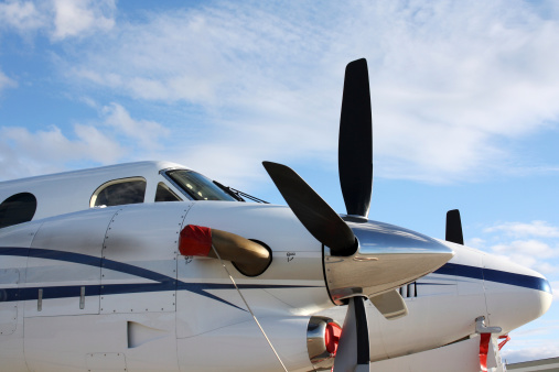 Close up of propellers on twin engine turbo prop airplane.